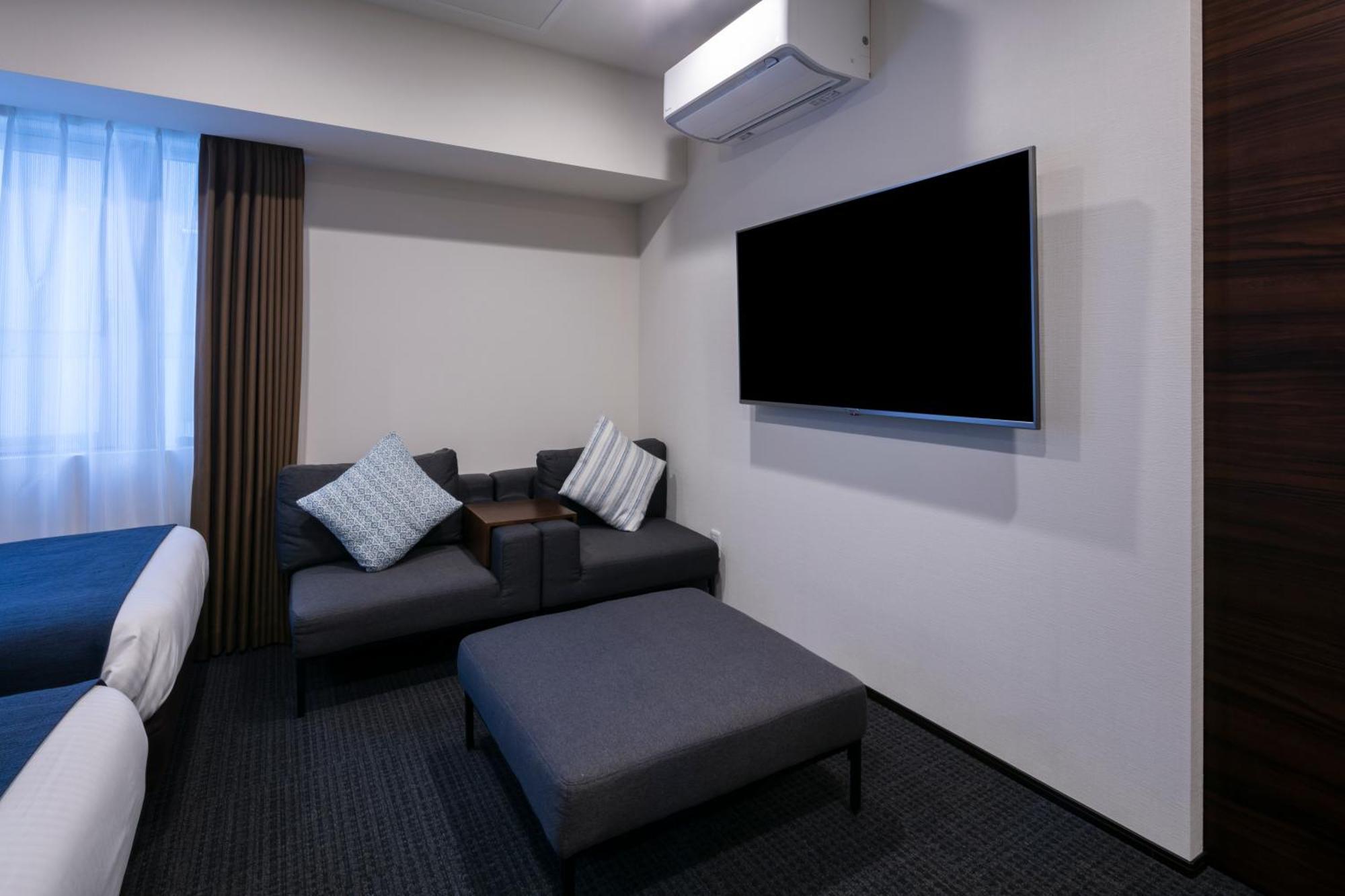 Randor Hotel Sapporo Suites Phòng bức ảnh A room at the hotel