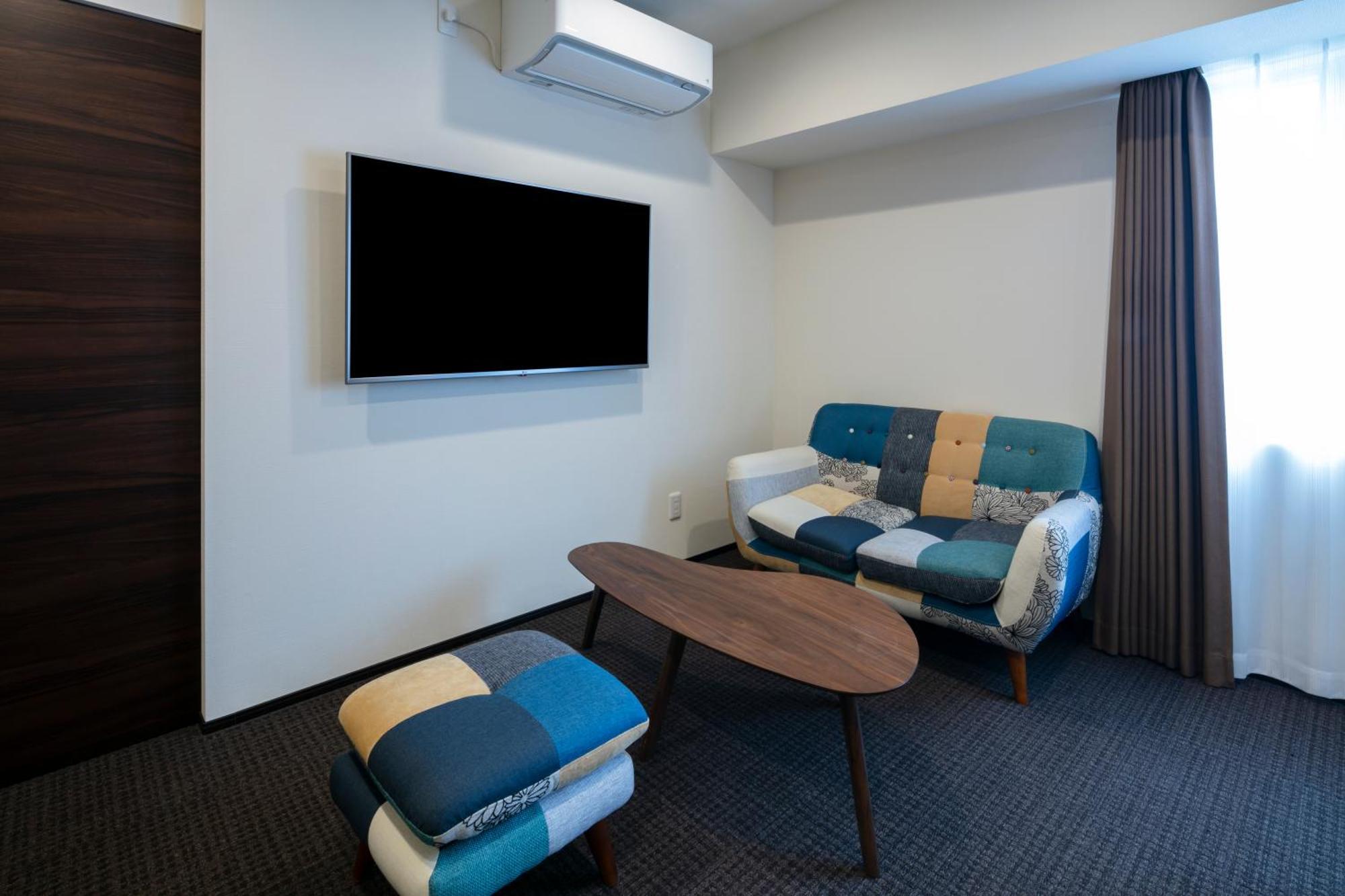 Randor Hotel Sapporo Suites Phòng bức ảnh A room at the hotel