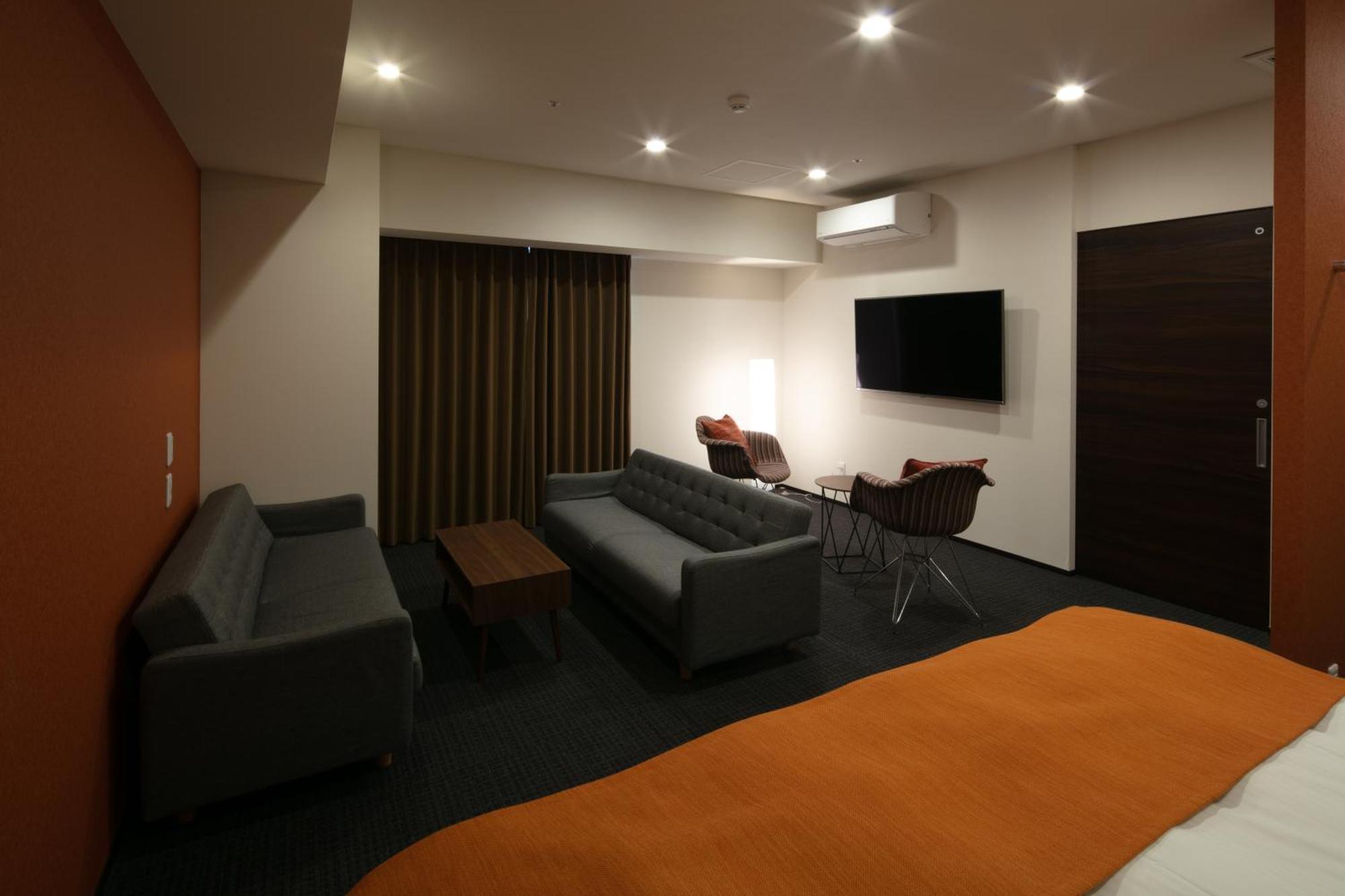 Randor Hotel Sapporo Suites Phòng bức ảnh A room at the hotel