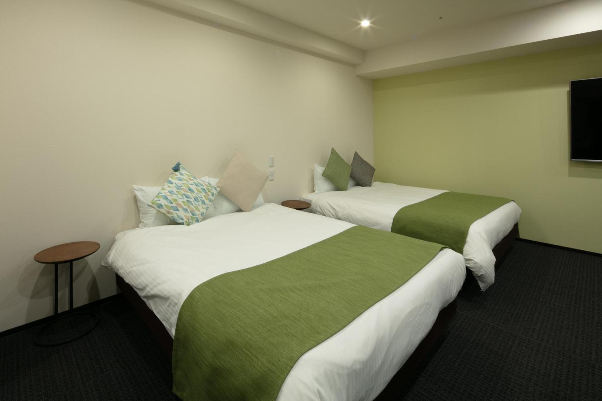 Randor Hotel Sapporo Suites Phòng bức ảnh A room at the hotel