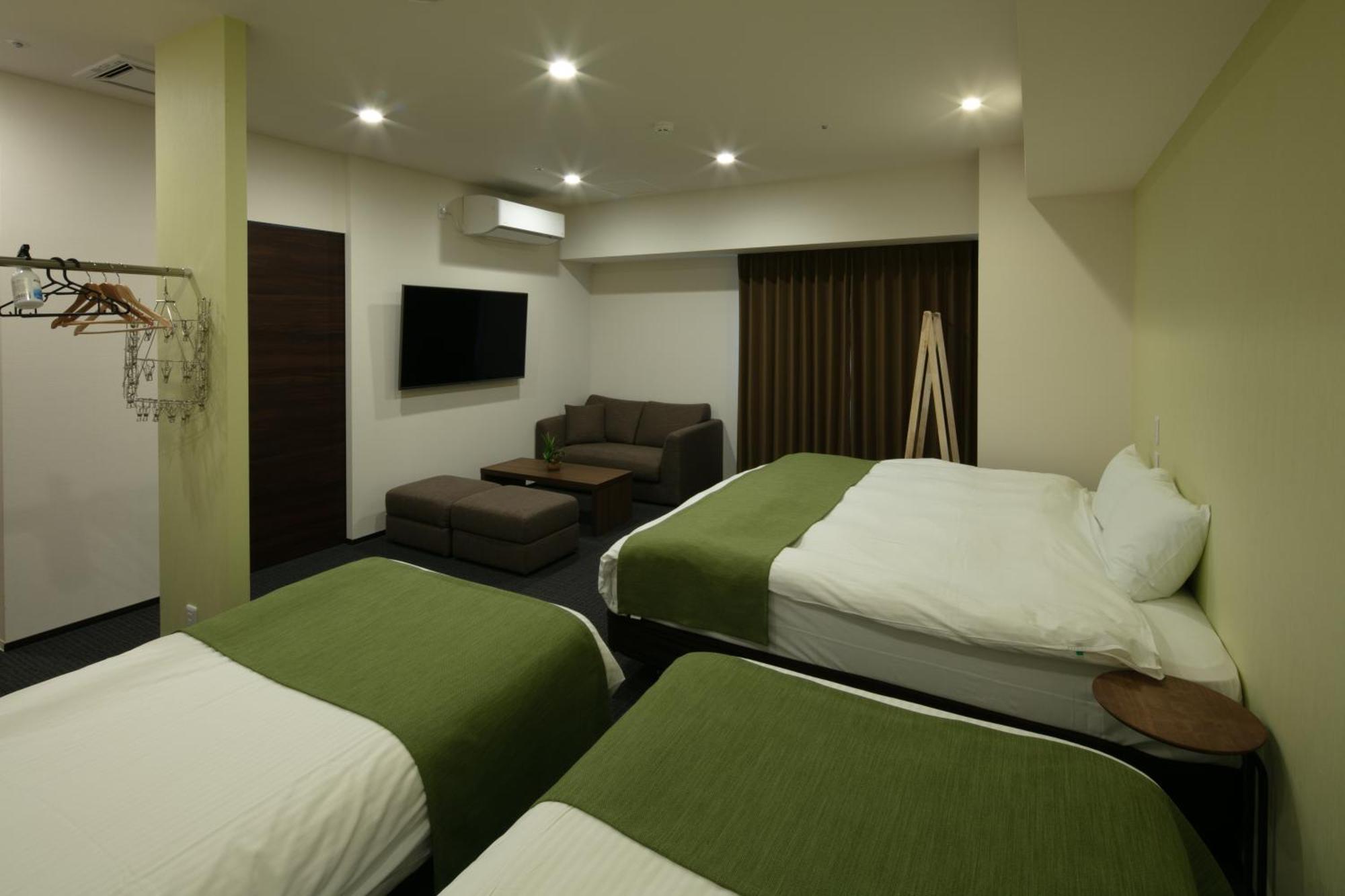 Randor Hotel Sapporo Suites Phòng bức ảnh A room at the hotel